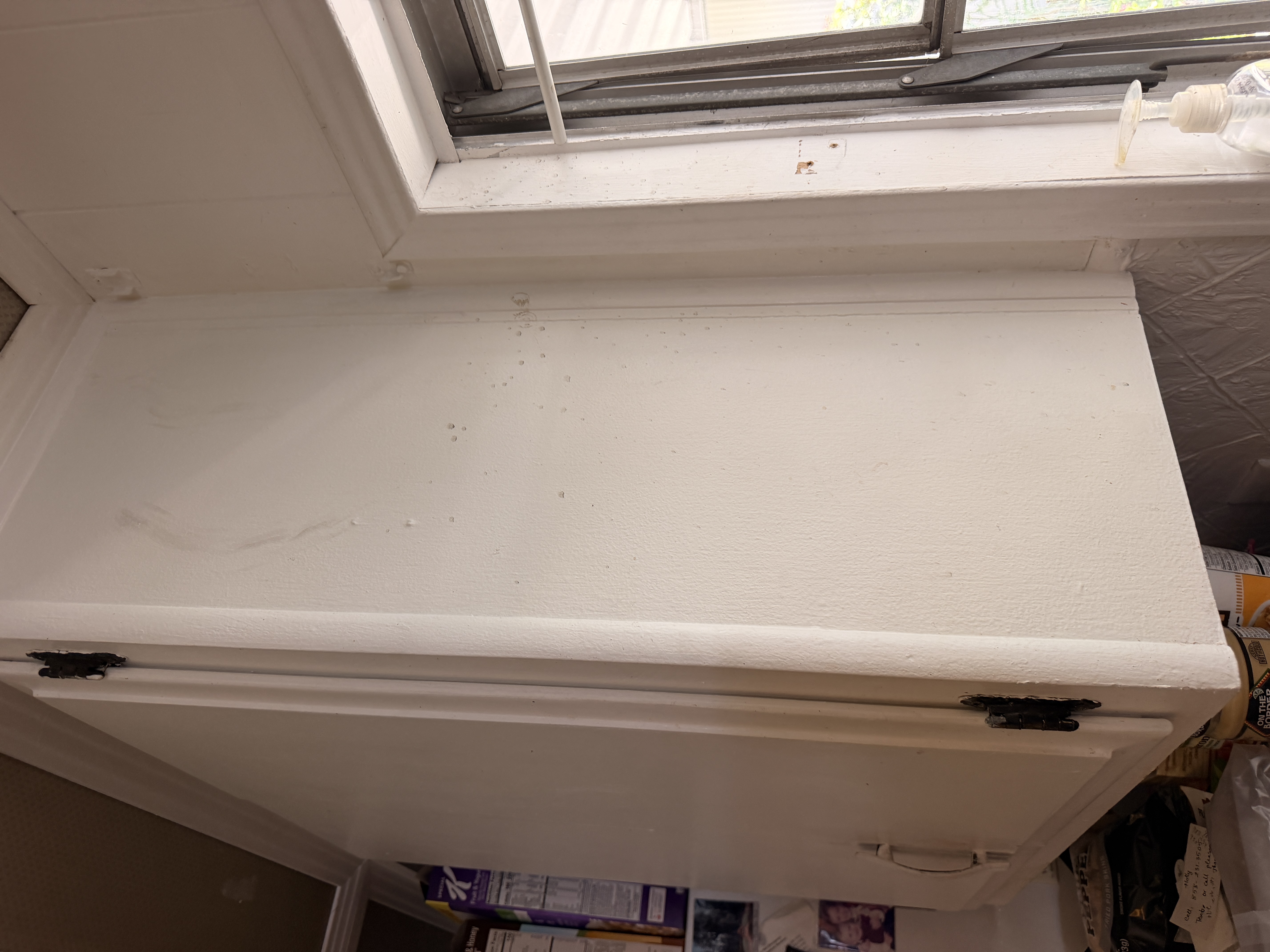 Cabinet side and trim before detailed cleaning